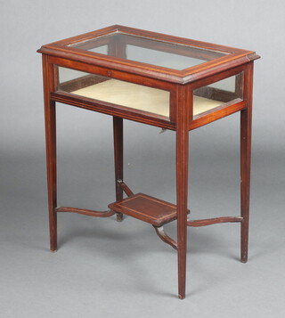 An Edwardian rectangular cross banded mahogany bijouterie table with hinged lid, raised on square tapered supports with rectangular undertier 76cm h x 63cm w x 41cm d 