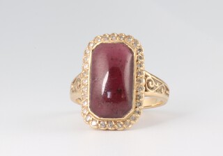 A yellow metal rounded rectangular cabochon cut garnet and diamond cluster ring, size O, 4.8 grams 