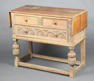 A 17th Century style bleached oak drop flap side table, fitted 2 short and 1 long drawer, raised on cup and cover supports 85cm h x 99cm w x 45cm d 