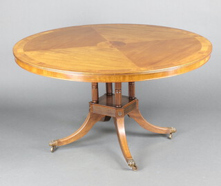 A Georgian style circular inlaid and crossbanded mahogany breakfast table raised on 4 turned columns with platform base and splayed feet 76cm h x 139cm diam. 