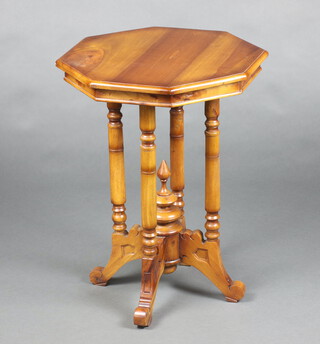 A Victorian style octagonal occasional table raised on 4 turned supports with cruciform base 65cm h x 50cm w x 49cm d 