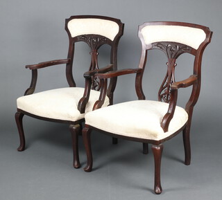 A pair of Edwardian mahogany open arm chairs with vase shaped slat backs and upholstered seats, raised on cabriole supports 96cm h x 58cm w x 53cm d (seats 21cm x 32cm) 