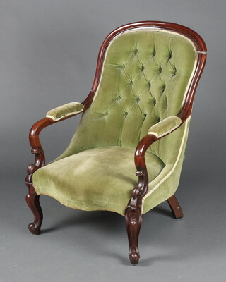 A William IV mahogany show frame open arm chair upholstered in green buttoned material, the seat of serpentine outline raised on cabriole supports 96cm h x 62cm w x 51cm d (seat 31cm x 35cm) 