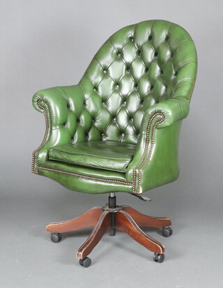 A Victorian style tub back revolving office chair upholstered in green buttoned leather 117cm h x 85cm w x 62cm d (seat 30cm x 38cm) 