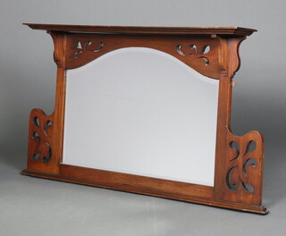 An Art Nouveau arched plate over mantel mirror contained in a pierced mahogany frame 70cm h x 122cm w x 16cm d 