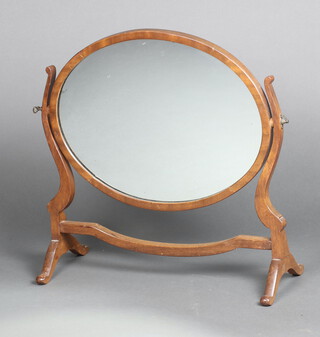 A Georgian style oval plate dressing table mirror contained in a mahogany swing frame 50cm h x 48cm w x 20cm d 