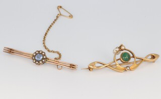 A yellow metal Art Nouveau hardstone and seed pearl brooch, a ditto topaz brooch 6.6 grams 
