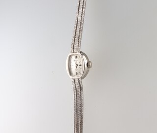 A lady's Bulova Dior 23 white metal 14k wristwatch and bracelet, gross weight 14 grams 