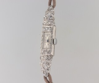 A lady's Art Deco platinum diamond set cocktail watch 55mm x 10mm on a silk strap 
