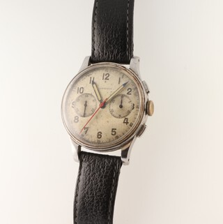 A gentleman's vintage steel cased Longines wristwatch with 2 subsidiary dials and red seconds hand, the dial inscribed Longines, contained in a bubble back 35mm case, numbered 23183/30, on a later leather strap  