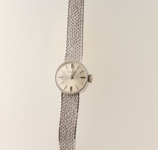 A lady's 9ct white gold Bulova wristwatch on a mesh bracelet, in a 15mm case, 17.6 grams including the glass the case 433449 7088-1