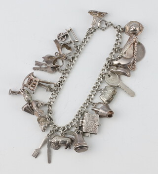 A silver charm bracelet, 42 grams