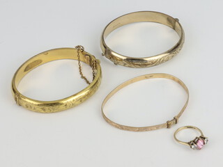 A yellow metal gem set ring size M 2.8 grams, 3 gilt bracelets 