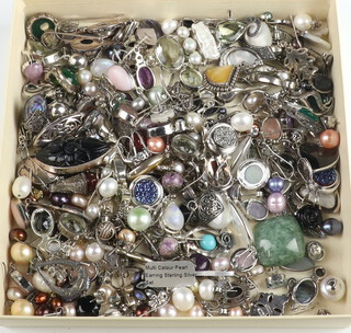 A quantity of silver mounted pearl stud and other earrings, together with silver mounted pendants