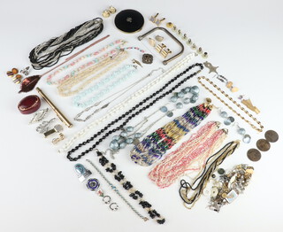 A quantity of vintage costume jewellery, necklaces, brooches, cufflinks etc 