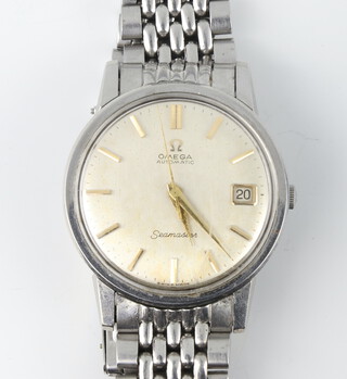 A gentleman's steel case Omega automatic Seamaster calendar wristwatch on a ditto bracelet, the movement numbered 24289030/565, the case numbered 166003/573 contained in a 33mm case 