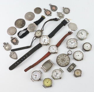Seven silver sports fobs and minor silver wristwatch cases