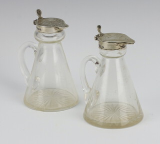 A pair of silver mounted glass toddy decanters Birmingham 1933 and 1934, 10cm 