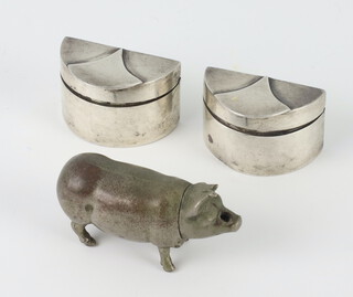 A pair of silver pill boxes London 1981 maker CJG 3cm, 43.4 grams, together with a metal vesta in the form of a pig 