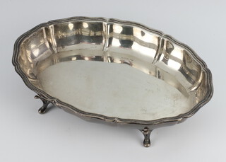 A silver shaped dish on scroll feet Sheffield 1940, 347 grams, 25cm 