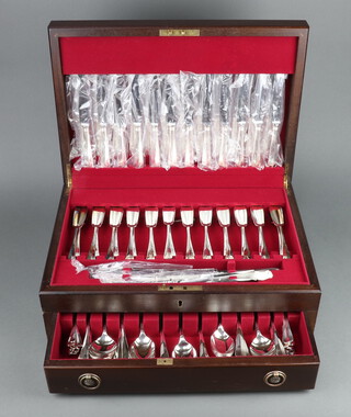 A mahogany canteen containing a set of silver plated rat tail pattern cutlery for 12, comprising 12 teaspoons, 12 coffee spoons, 12 soup spoons, 12 dessert spoons, 4 table spoons, 12 dessert forks, 12 dinner forks, 12 fish knives, 12 fish forks, 12 dinner knives, 12 dessert knives and a 3 piece carving set 