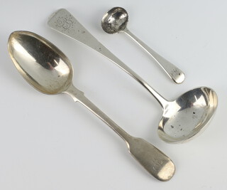 A George III silver ladle with engraved monogram London 1810, a Victorian dessert spoon and a Georgian mustard spoon 114 grams 