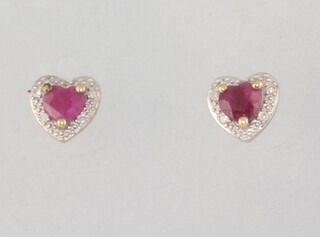 A pair of yellow metal ruby and diamond ear studs 1.3 grams, together with a pair of 9ct paste studs and a 9ct yellow gold paste set necklace