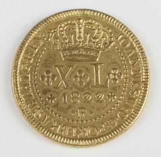 A four pound Brazil coin dated 1822, now gold plated