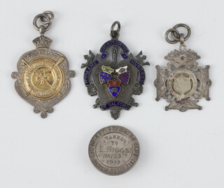 A silver sports fob and 3 others 47.5 grams