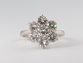 A white metal 18ct 7 stone diamond cluster ring, size K, 4.7 grams, approx. 2.2ct, colour F/G, clarity SI1