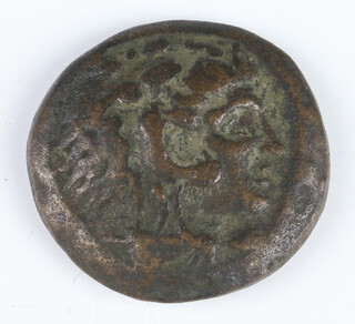 Ancient Greek, a bronze coin for Alexander The Great (330-320BC), 1 side of the coin shows the head of Heracles the other side carries the vertical legend Alexandrou 