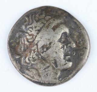 A silver ancient Greek Tetradrachm coin dated between 400 and 300BC, 13.3grams 