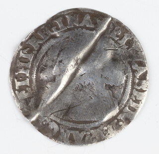 A silver six pence coin of Elizabeth I, folded and then reflattened 