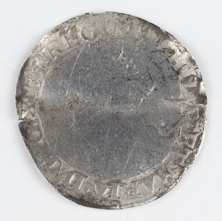 A silver three pence coin of Elizabeth I, folded and then reflattened  