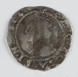 A silver penny coin of Elizabeth I with an inscription error, The legend on the reverse reads CIVITATIS DONLON instead of LONDON 