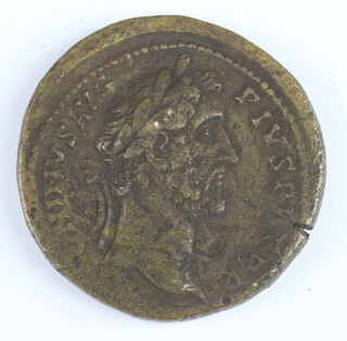 A brass sestertius coin for Antoninus Pius, Rome 146AD, the reverse shows Antoninus in a triumphal quadriga 