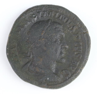 A brass dupondius coin for Maximin I, Rome 235/6AD, the reverse side shows Providentia with a globe at her feet 