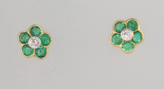 A pair of yellow metal 750 emerald and diamond ear studs, 5mm, 2.5 grams