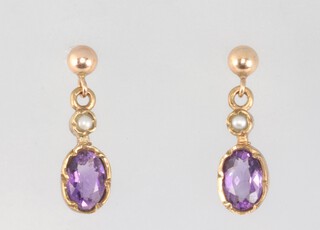 A pair of 9ct yellow gold amethyst ear studs 1.3 grams