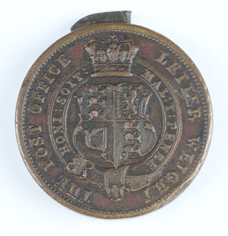 A one penny post brass letter weight dated 1839, minted by H Cooper on 12 August 1839 for post office use as a one ounce weight 