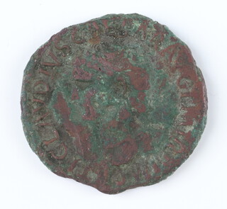 A copper As coin of Claudius, Rome 41/2AD, the reverse shows Libertas standing and holding a pileus 