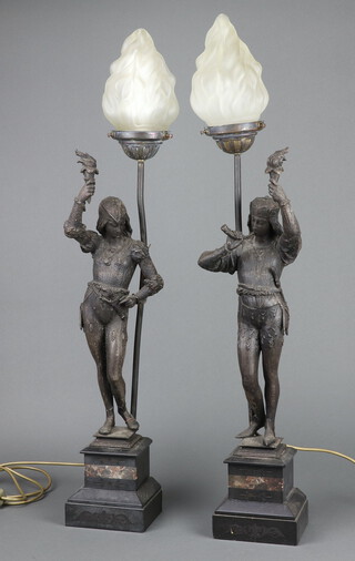 A pair of 19th Century spelter figures depicting 17th Century characters, both bearing torches, raised on 2 colour marble square bases, converted for use as table lamps and with opaque glass torch shades 80cm h x 13cm w x 11cm d 