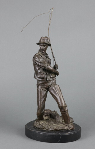 A 20th Century bronze figure of an angler raised on an oval marble base 44cm h 