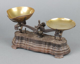 A set of iron domestic pan scales with brass pans 15cm x 26cm x 7cm 