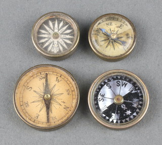 Four miniature compasses