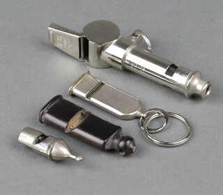 An Acme Thunderer and Acme City double whistle, a horn whistle and 2 other whistles 