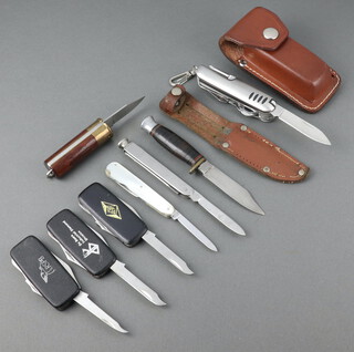 Ibberson a twin bladed pocket knife with mother of pearl grip (chip to grip), Kaicut pocket knife the grip in the form of a shot gun cartridge, a miniature Bowie knife with 7cm blade and leather scabbard, an unmarked multi bladed knife with leather case, 3 unmarked multi bladed knives, a smokers 2 bladed knife 