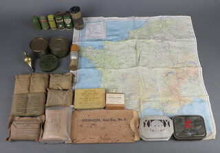 The American Bread Company - an orange nut roll in ration tin, a collection of American military field dressings together with  a second edition Zone of France escape and evasion map etc, the bottom left hand corner marked 1.59 (WEA) Mar 44 