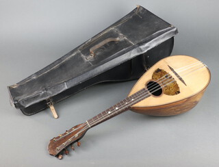A mandolin labelled Giovanni Montaldi, with carrying case 