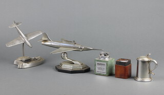 A Dunhill lighter in the form of a lidded tankard 7cm, a lighter in the form of a jet aeroplane (f), 2 other lighters and an aluminium ashtray  decorated aircraft 
